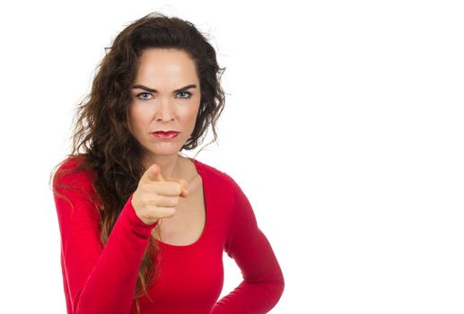 A very annoyed angry and irritated woman pointing towards camera. Isolated on white.