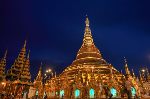 Shwedagon Pagoda in Yangon City, Burma with Beautiful Night Light: the beautiful golden pagoda, the oldest historical pagoda in Burma and the world, in the evening with great evening light.