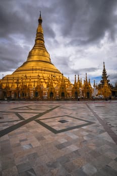 Shwedagon Pagoda Temple shining in the beautiful sunset in Yangon, Myanmar (Burma)