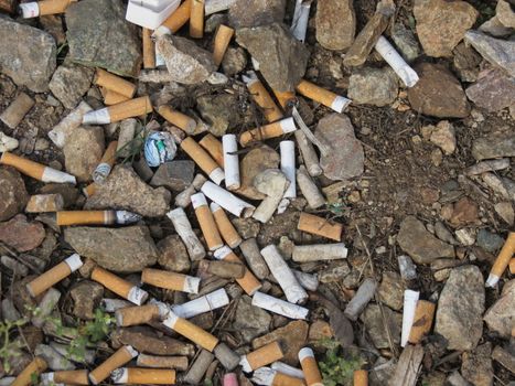 closeup of many dirty cigarettes butts background  closeup of many dirty cigarettes butts background 