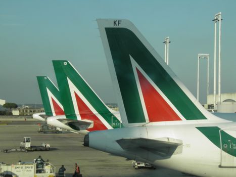ROME, ITALY - NOVEMBER 11, 2011: Airplanes of the Italian national airlines Alitalia parked at the airport