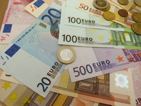 Euro (EUR) banknotes and coins money useful as a background or money concept