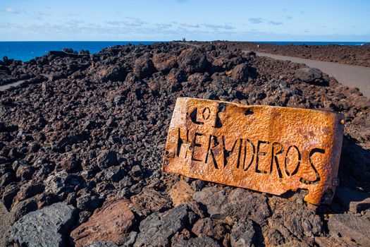 Los Hervideros, coastline in Lanzarote with waves and volcano