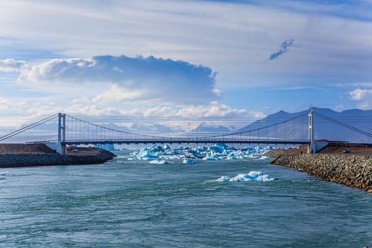 Icebergs in the strait to the bridge glacier lake Jokulsarlon, glacier Vatnajokull, Iceland.