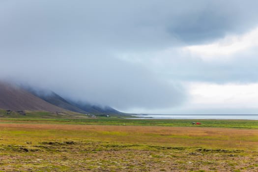 Cloudy sky over the coast in the East Fjords Iceland. Panorama