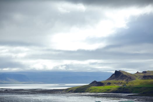 Cloudy sky over the coast in the East Fjords Iceland.