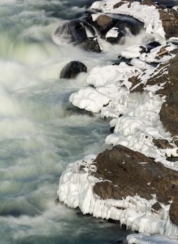 Great Falls on Potomac river outside Washington DC in winter with ice forming on the cascades and snow on the rocks