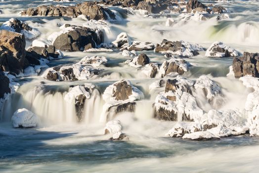 Great Falls on Potomac river outside Washington DC in winter with ice forming on the cascades and snow on the rocks