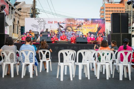 PHUKET, THAILAND - 07 FEB 2014: Unidentified musicians play on a stage with audience on front during annual old Phuket town festival. 