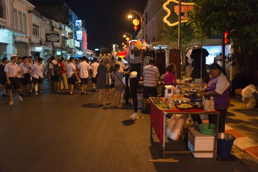 PHUKET, THAILAND - 07 FEB 2014: Unidentified people walk on central pedestrian street during annual old Phuket town festival at night. 