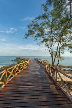 An old wooden pier on the Indian ocean built on the shores of Prison Island in Zanzibar, Tanzania