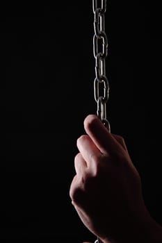 human hands taking a chain