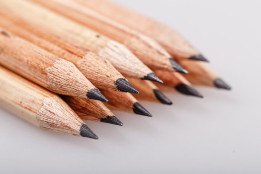 Graphite wooden pencils for sketching shot closeup background