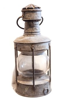 Old oil lamp on the white background