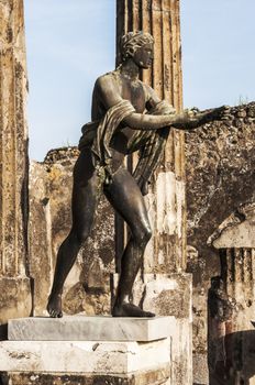 bronze statue inside the pompeii ruins, italy