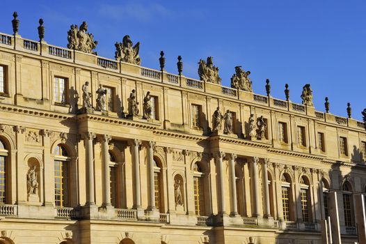 facade of the chateau of Versailles in the morning at sunrise