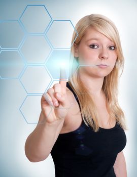 Blond woman pressing group of buttons with one hand