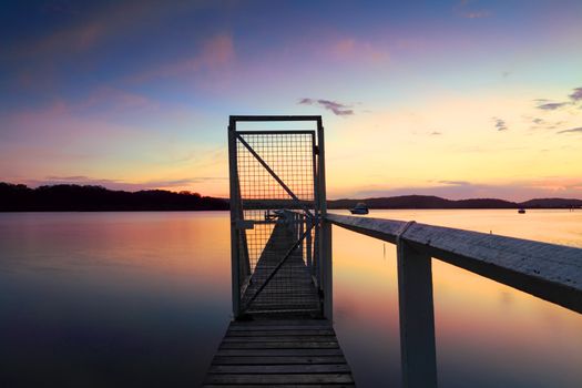 Peaceful sunset jetty wharf Kincumber, Central Coast, Australia