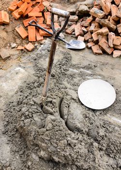 Shovel in fresh cement on a construction site