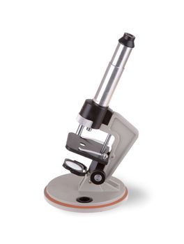 Old microscope isolated on a white background