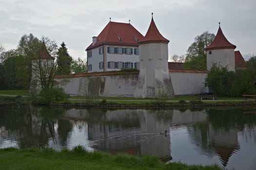 The castle was built between two arms of the River Wurm for Duke Albert III, Duke of Bavaria in 1438–39 as a hunting-lodge, replacing an older castle burned down in war.