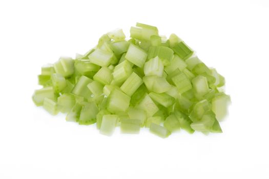 Chopped raw celery isolated on white background.