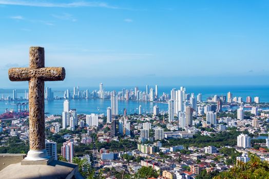 View of the modern part of Cartagena, Colombia with a stone cross in the foreground