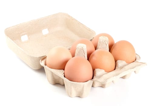 eggs in cardboard tray on white background with clipping path