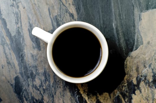 Cup of not hot  coffee  on stone table  background 