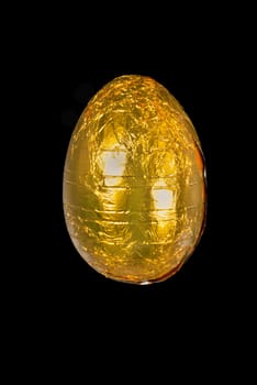 Close-up of a yellow chocolate Easter egg.