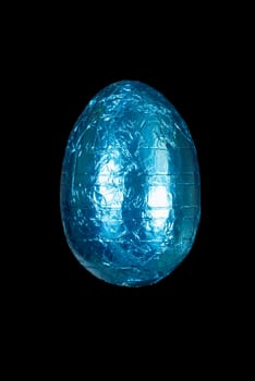 Close-up of a blue chocolate Easter egg.
