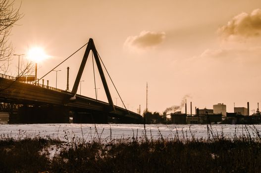 Bridge and steel industry on late afternoon