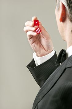 Over the shoulder shot of a gentleman preparing to roll the dice.