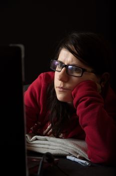 Girl in red sweater using notebook