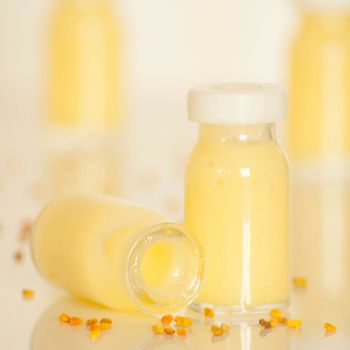 raw organic royal jelly in a small bottle