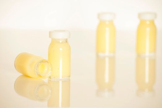 raw organic royal jelly in a small bottle