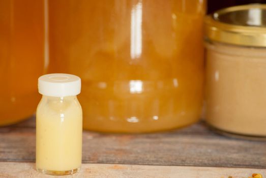 raw organic royal jelly in a small bottle