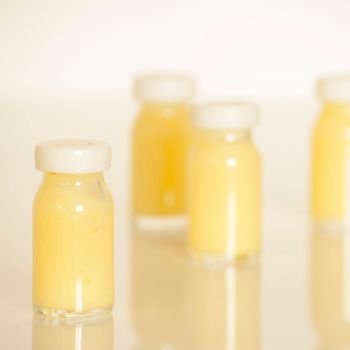 raw organic royal jelly in a small bottle