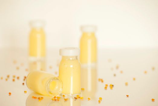 raw organic royal jelly in a small bottle