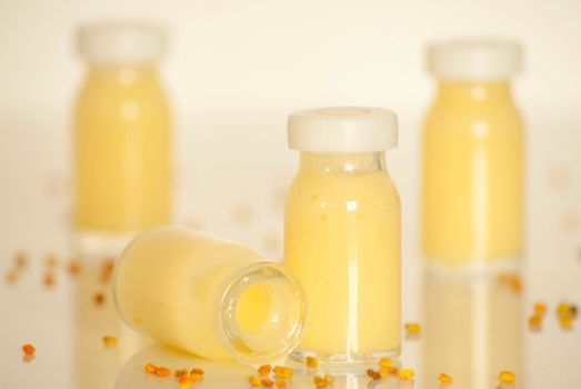 raw organic royal jelly in a small bottle