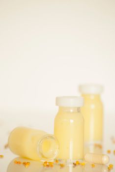 raw organic royal jelly in a small bottle