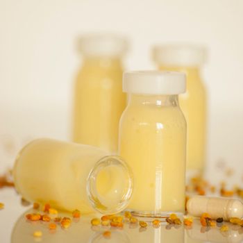 raw organic royal jelly in a small bottle