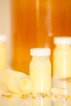 raw organic royal jelly in a small bottle