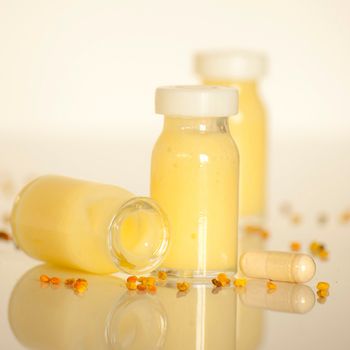 raw organic royal jelly in a small bottle