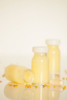 raw organic royal jelly in a small bottle