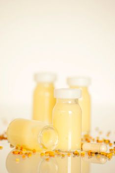 raw organic royal jelly in a small bottle