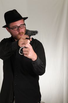 Black Dressed Young Man Holding a Pistol Gun