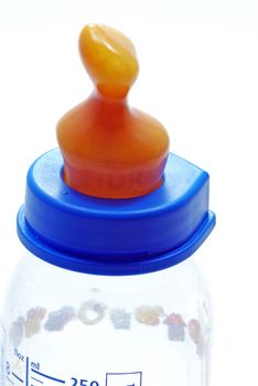 Feeding bottle with nipple on a white background