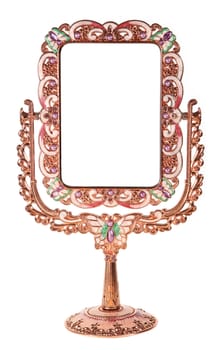 Metallic mirror on a stand on a white background, souvenir