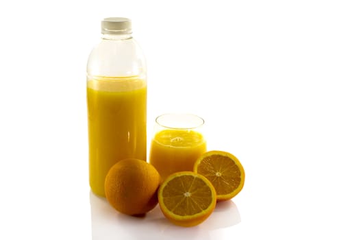 bottle and glass with fresh orange juice isolate on white